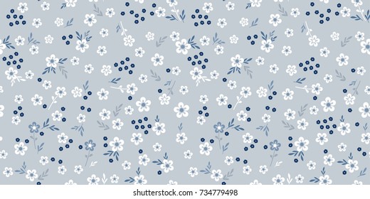 Delicate blue flowers texture. Cute flowery pattern for fashion print. Seamless floral background for design fabric, wallpaper, wrapping, paper.