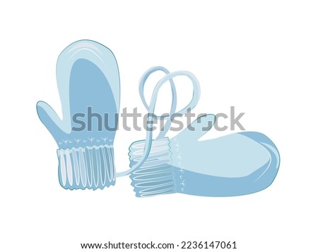 Delicate blue winter mittens on a string.
