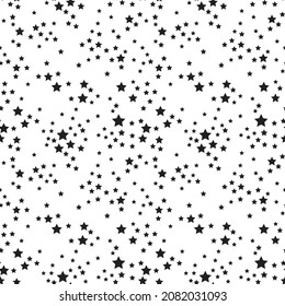 Delicate minimalistic ornament with black little stars a white background. Seamless pattern with textured drawings.