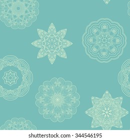 Delicate ornamental seamless pattern with snowflakes. Seamless blue
winter texture for design, decoration and wrapping