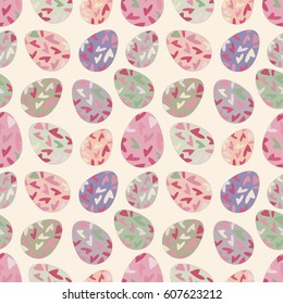 Delicate seamless pattern with random placed multicolored Easter eggs. Chicken eggs colored with hearts and placed on light background. Light pastel colors. 