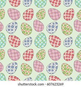 Delicate seamless pattern with random placed multicolored Easter eggs. Paschal 
 chicken eggs colored with geometrical flowers and placed on light green background. Light pastel colors. 