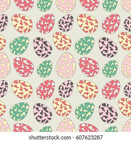 Delicate seamless pattern with random placed multicolored Easter eggs. Paschal chicken eggs colored with hearts and placed on light background. Light pastel colors. 