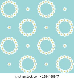 Delicate seamless pattern with small chamomile and wreaths on a blue background. Children's textiles, covers for girls, women's print.