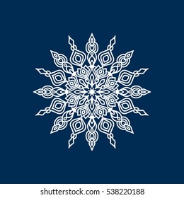 Delicate white Christmas snowflake on blue background