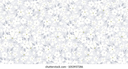 Delicate white flowers on blue background. Floral seamless pattern for fashion prints. Soft texture for design textile, wallpapers, wrapping, paper.