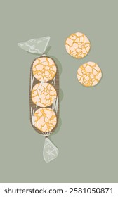 Delicious Baked sugar biscuits wrapped in plastic packaging on dusty green background