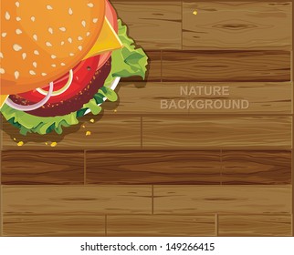 Delicious big hamburger seed standing on wooden table. Fast food background.