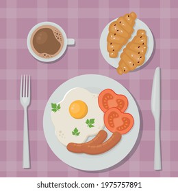 delicious breakfast: fried eggs, coffee and croissants