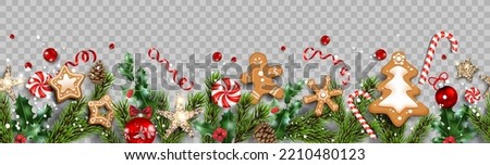 Delicious composition with gingerbread and Christmas decorations. Balls, stars, gingerbreads, fir tree branches isolated. Winter holiday banner