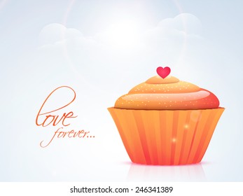 Delicious cup cake with red heart and text Love Forever for Happy Valentine's Day celebration on shiny cloudy sky background.