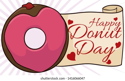 Delicious doughnut with a heart shape glaze flavored with strawberry jelly and a greeting scroll ready to celebrate a happy Donut Day.