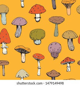 delicious fresh forest mushrooms on orange background, seamless pattern, isolated