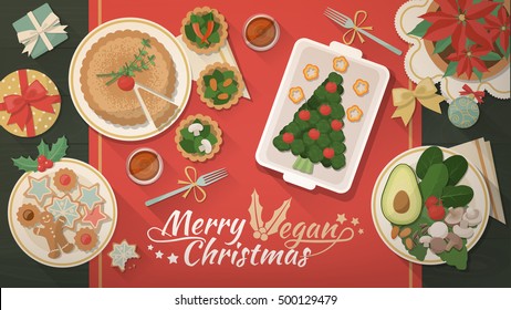 Delicious vegan food on a Christmas table with gifts and decoration, top view