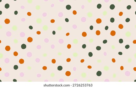 Delícia pontos dispersos padrão em laranja, rosa, verde e cinza escuro em um fundo cremoso.