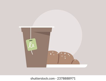 A delightful still life composition featuring a paper to-go cup with a tea bag steeping inside, accompanied by a croissant placed on a plate