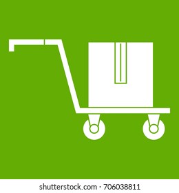 Delivery cart with box icon white isolated on green background. Vector illustration