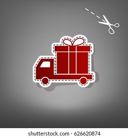 Delivery gift sign. Vector. Red icon with for applique from paper with shadow on gray background with scissors.