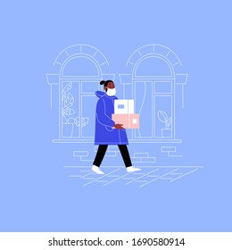Delivery guy on his way to a client with two boxes walking down the street wearing medical face mask