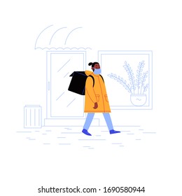 Delivery guy on his way to a client with a thermobag walking down the street wearing medical face mask