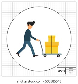 Delivery man carrying boxes on trolley