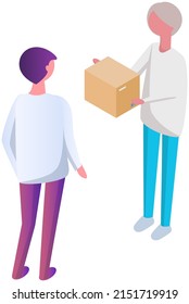 Delivery man stands holding cardboard box in his hands. Male courier delivers package to customer. Delivery company employee gives order to client. Goods transport service worker holding box parcel