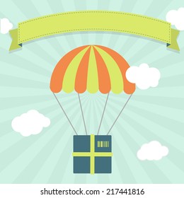 Delivery with parachute. Package hanging from a parachute in the sky representing delivery, freight, shipping.  Blank ribbon for insert text.