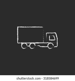 Delivery truck hand drawn in chalk on a blackboard vector white icon isolated on a black background.