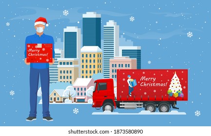 Delivery trucks delivering Christmas gift and Courier in a face mask and a Christmas hat with a box in his hands in the city and snow falling. Delivering by to home. Gifts in bright boxes Winter city.