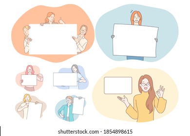 Demonstration, promotion, advertisement concept. Young positive cartoon characters holding and pointing with fingers at white blank placard with copy space for text and advertising isolated over white