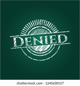 Denied written on a chalkboard
