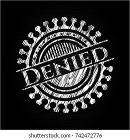 Denied written on a chalkboard