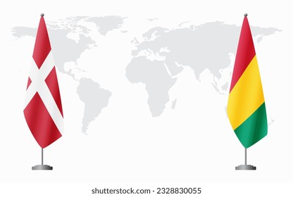 Denmark and Guinea flags for official meeting against background of world map.