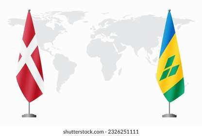 Denmark and Saint Vincent and the Grenadines flags for official meeting against background of world map.