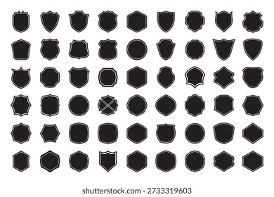 A dense arrangement of various black shield silhouettes fills the frame showcasing diverse heraldic shapes and designs high-quality