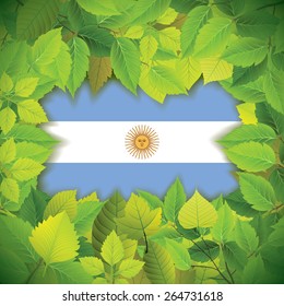 Dense, green leaves over the flag of Argentina