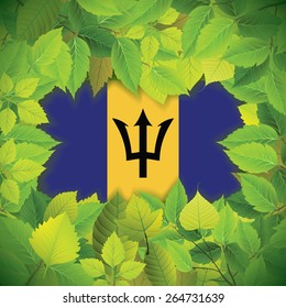 Dense, green leaves over the flag of Barbados