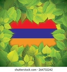 Dense, green leaves over the flag of Armenia