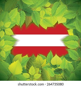 Dense, green leaves over the flag of Austria
