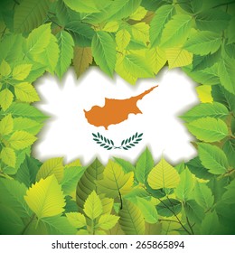 Dense, green leaves over the flag of Cyprus