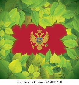Dense, green leaves over the flag of Montenegro
