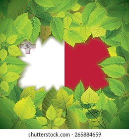 Dense, green leaves over the flag of Malta