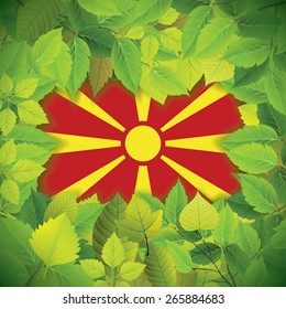 Dense, green leaves over the flag of Macedonia
