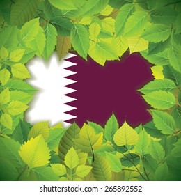 Dense, green leaves over the flag of Qatar