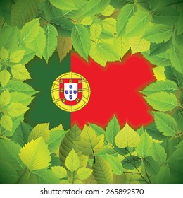 Dense, green leaves over the flag of Portugal