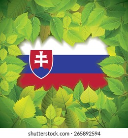 Dense, green leaves over the flag of Slovakia