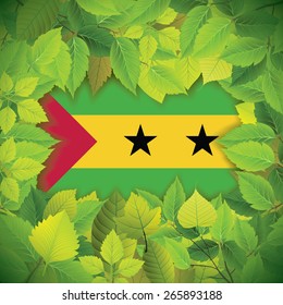 Dense, green leaves over the flag of Sao Tome and Principe