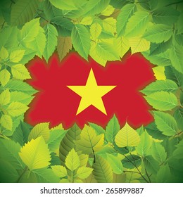 Dense, green leaves over the flag of Vietnam