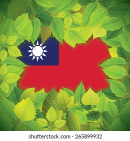 Dense, green leaves over the flag of Taiwan