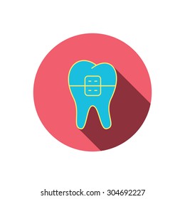 Dental braces icon. Tooth healthcare sign. Orthodontic symbol. Red flat circle button. Linear icon with shadow. Vector